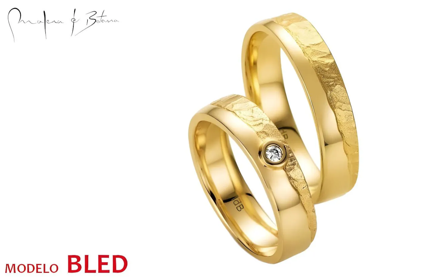 Par de anillos de boda en oro amarillo 18K con acabado texturizado y una piedra incrustada en uno