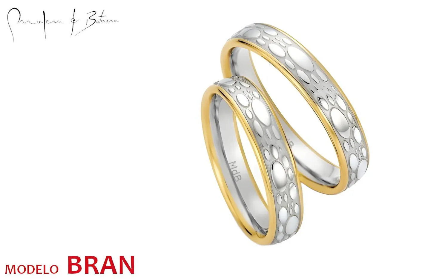 Par de anillos de boda bicolor en oro amarillo y blanco 18K con patrón texturizado en la banda central