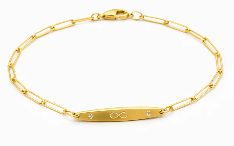 Pulsera de oro con símbolo infinito y brillantes, diseño elegante y moderno